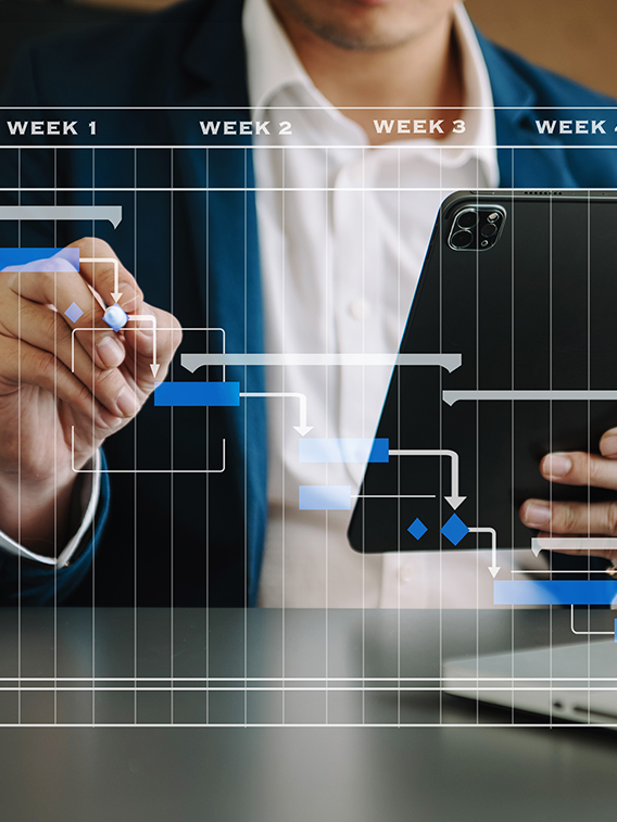 Project manager working and update tasks with milestones progress planning and Gantt chart scheduling diagram.business tram working at office