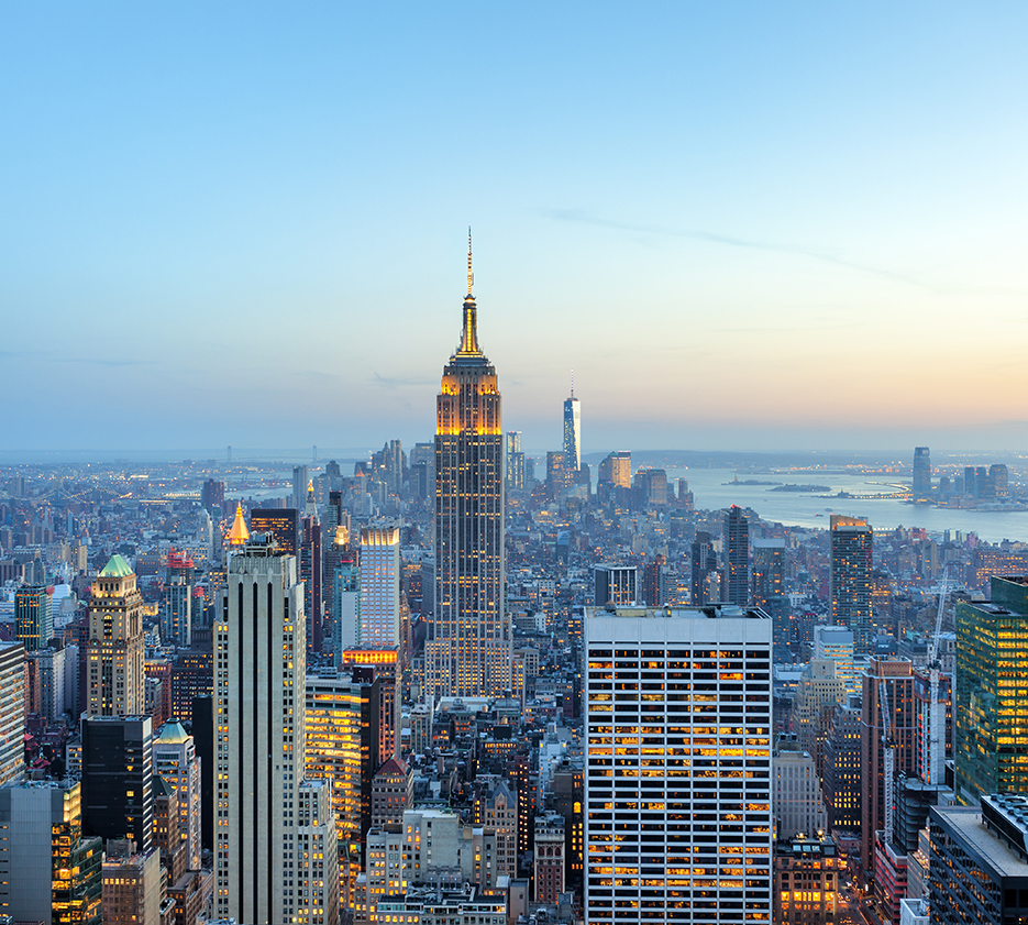 illuminated skyscrapers in Manhattan at evening with Empire State Building and Freedom Tower - the new World Trade Center, New York City